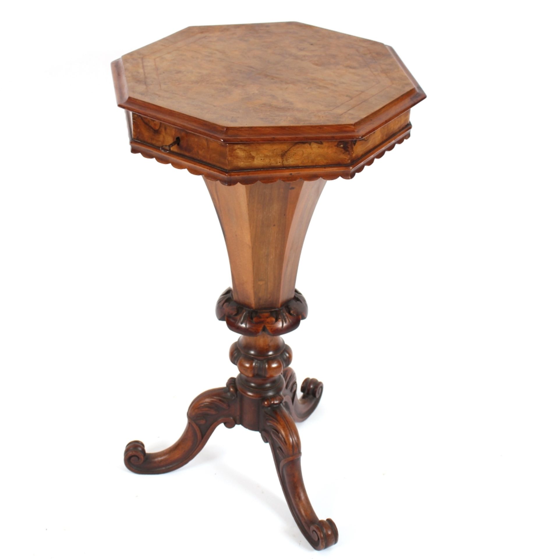 A Victorian walnut trumpet shaped work table, the octagonal lid opening to reveal a partitioned
