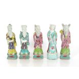 Five 18th Century porcelain polychrome decorated figures of dignitaries, the tallest 22.5cm