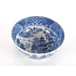 A large 19th Century blue and white English pottery bowl decorated in the Chinese manner with