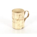 A 18th Century creamware mug with entwined wrythen handle, marked "Mary Morphew Dover 1771", AF,