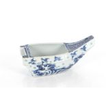 A late 19th Century Japanese blue and white jardinière in the form of a boat decorated in underglaze