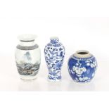 A 19th Century Chinese blue and white vase, decorated prunus blossom; a tall blue and white baluster