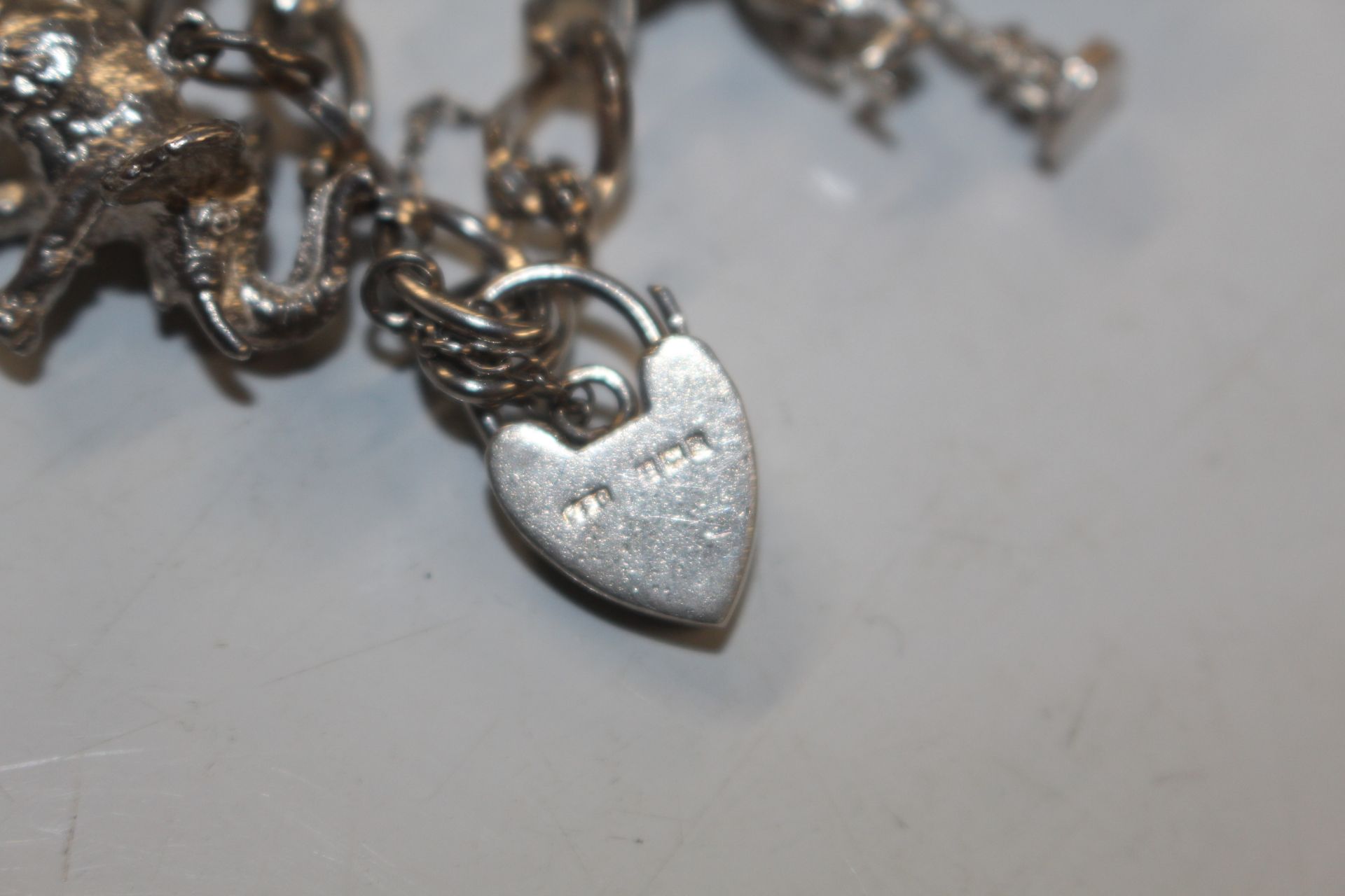 A Sterling silver charm bracelet approx. 57gms - Image 3 of 15