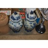 A pair of large blue and white dragon decorated gi