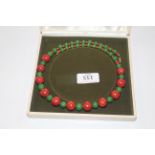 A jadeite apple coral and coral bead necklace