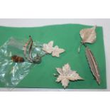Five Sterling silver leaf themed brooches, approx.