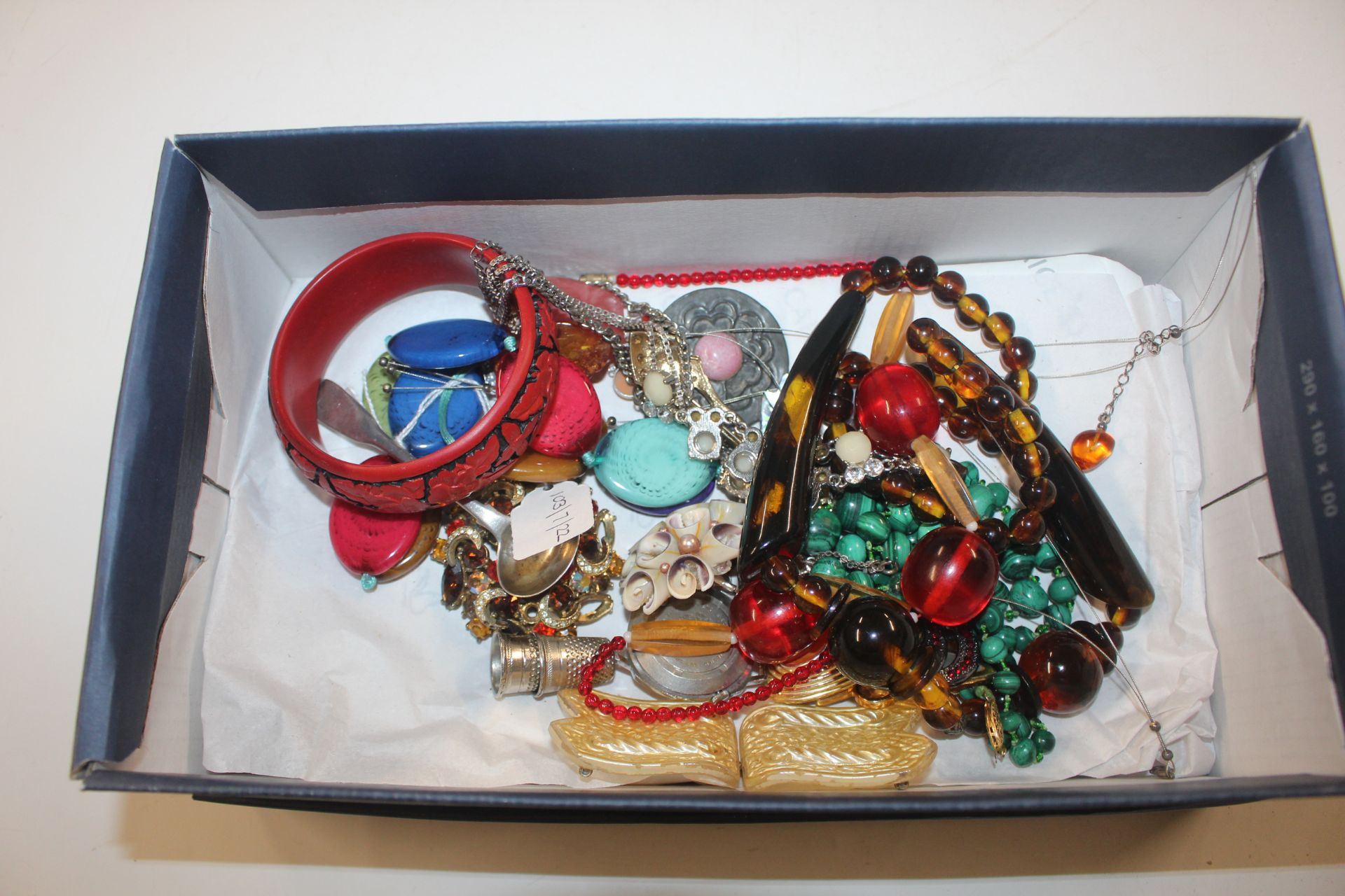 A box of various costume jewellery