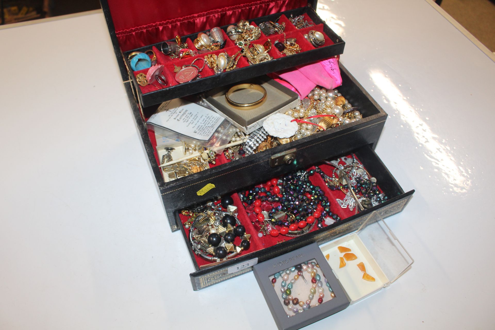 A jewellery box and contents of assorted costume j