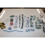 A tub of various beadwork jewellery etc.