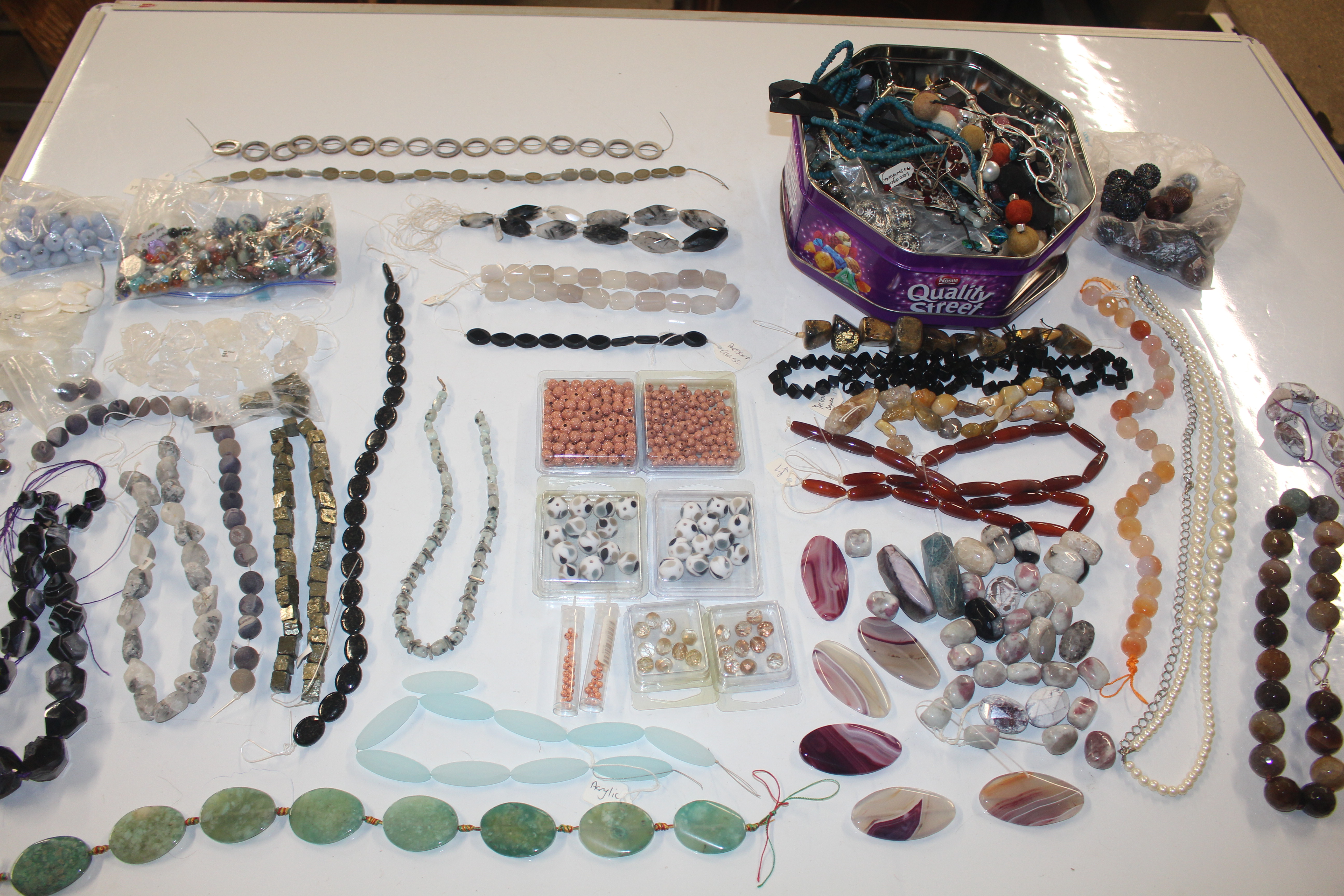 A large quantity of various beaded and white metal