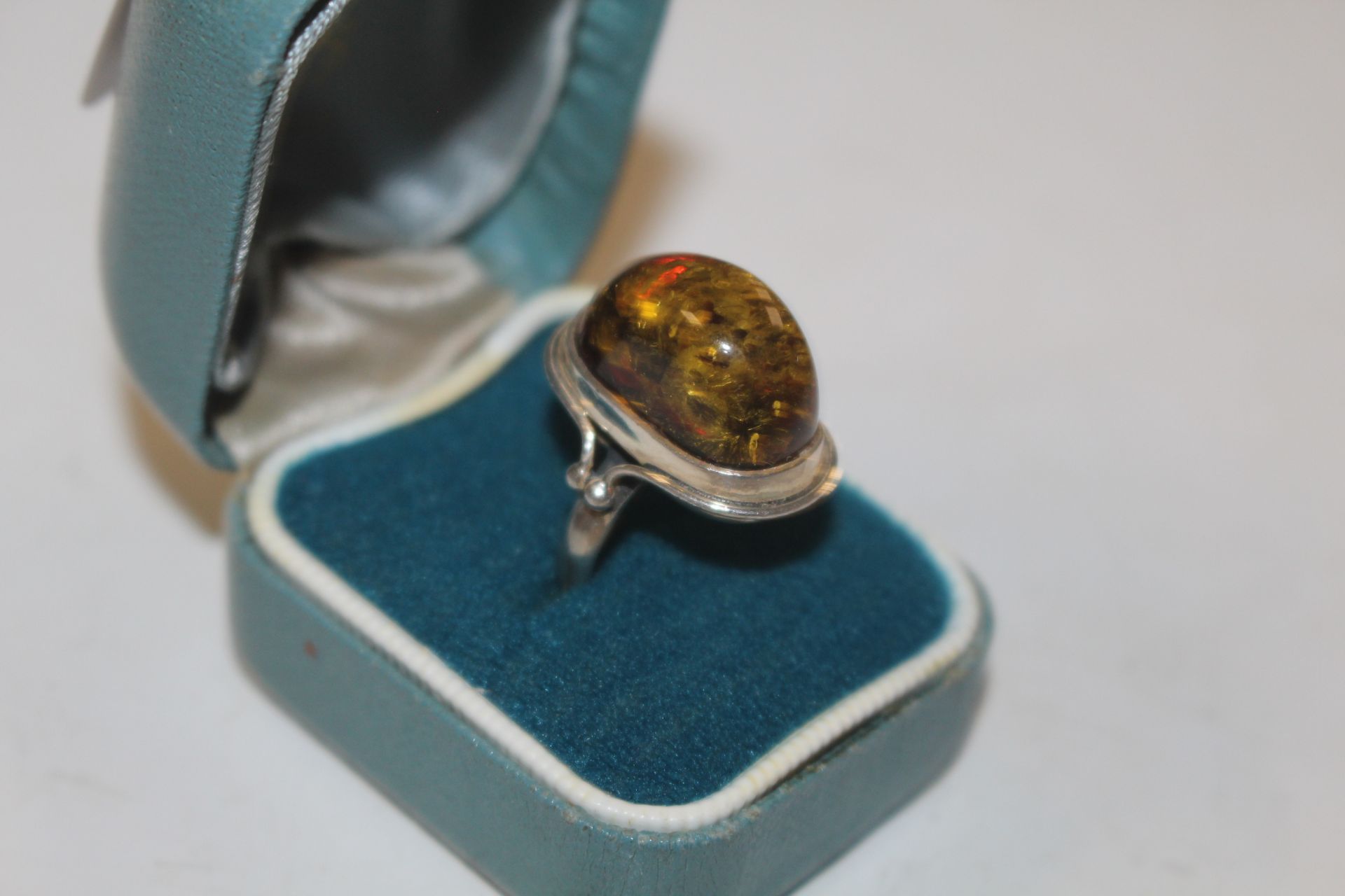 A Sterling silver and amber set ring, size K, appr