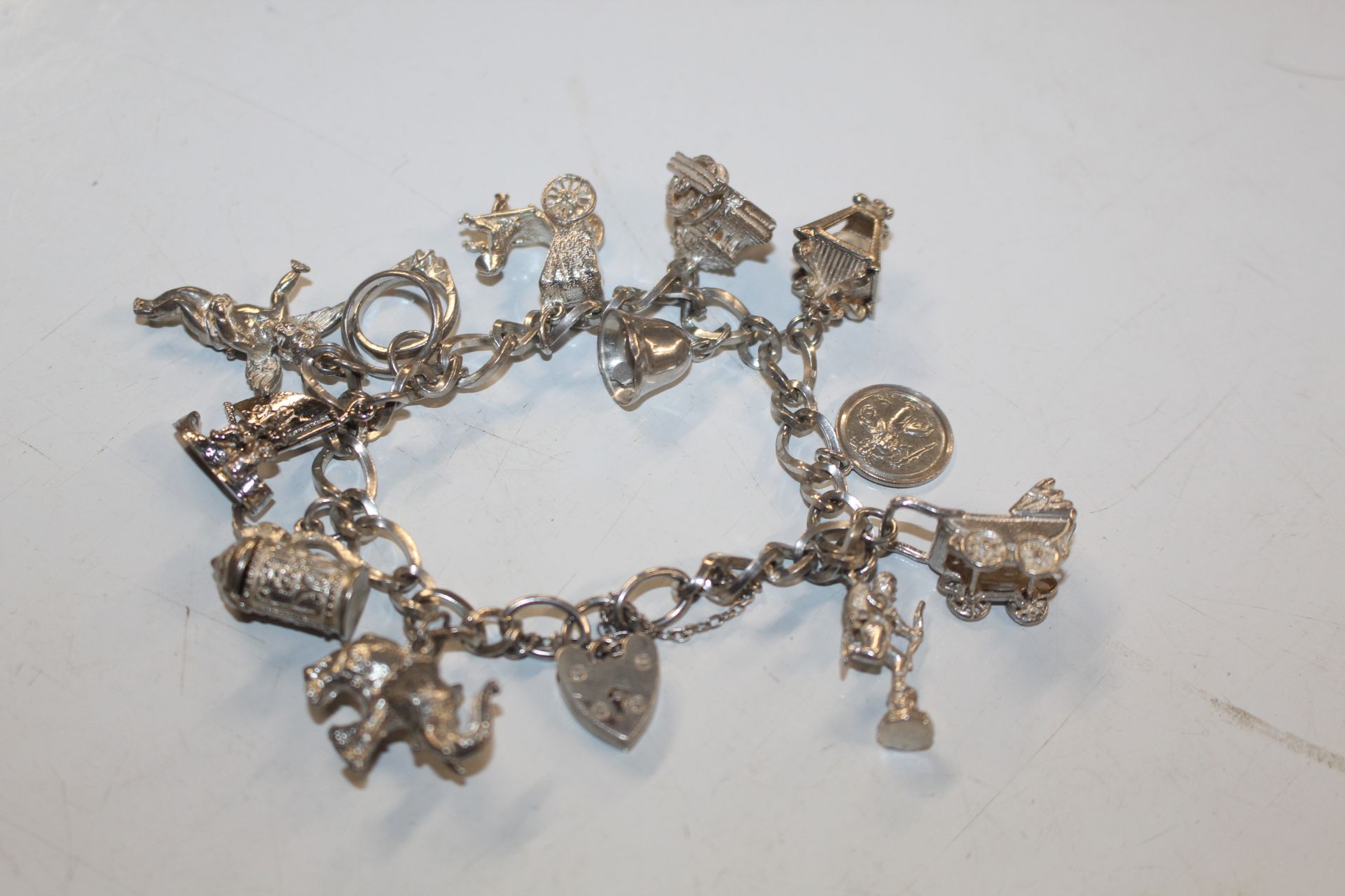 A Sterling silver charm bracelet approx. 57gms