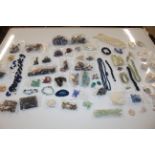 A tub of various beadwork jewellery etc.