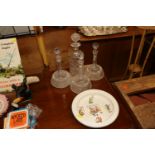 Four glass decanters and stoppers; and a hot water