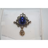 A blue Jelly Belly brooch