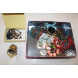 A box containing various costume jewellery