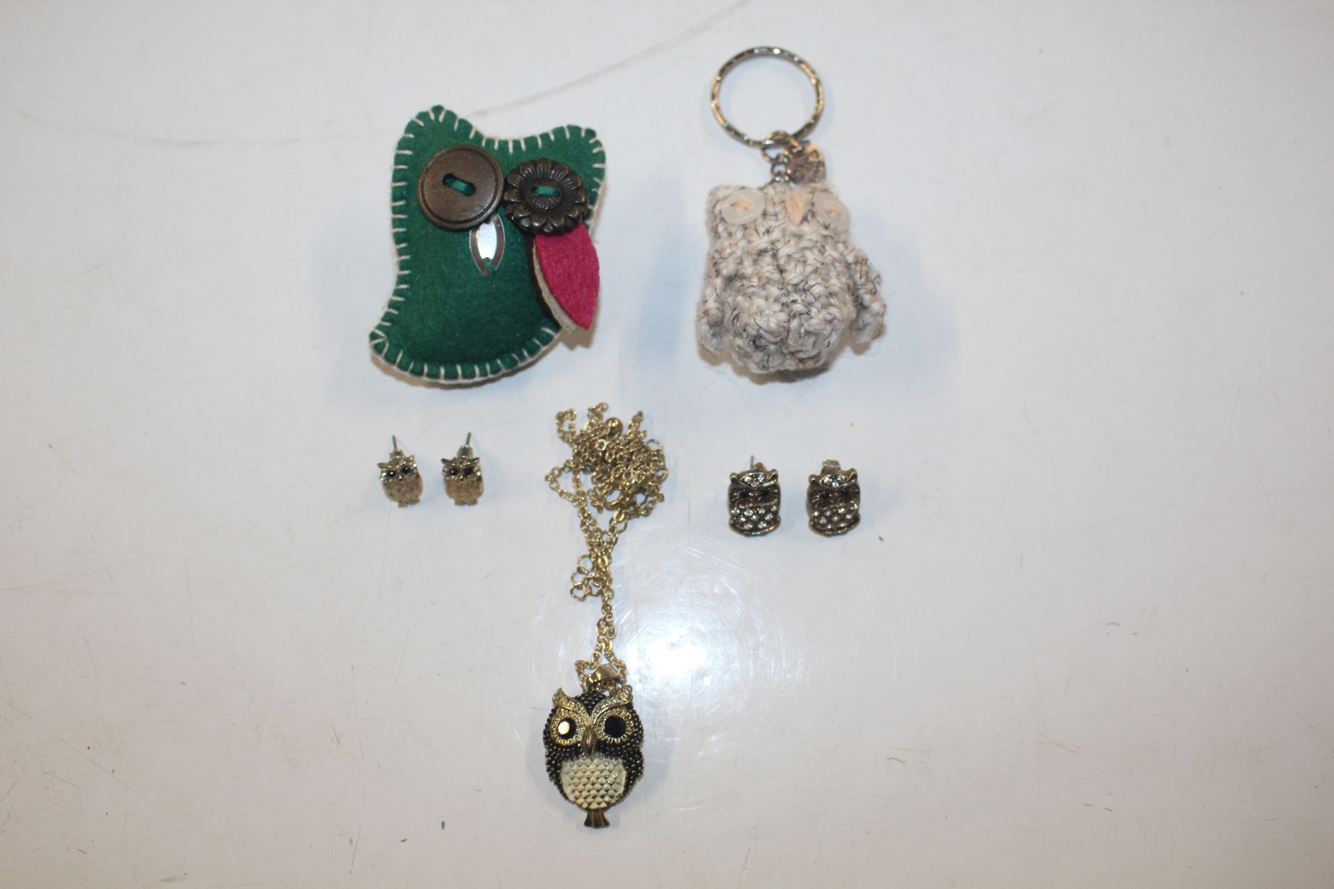 A small collection of various owl decorated jewell