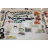 A tub of various beadwork jewellery etc.