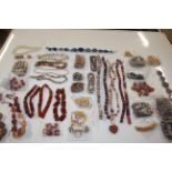 A tub of various beadwork jewellery etc.