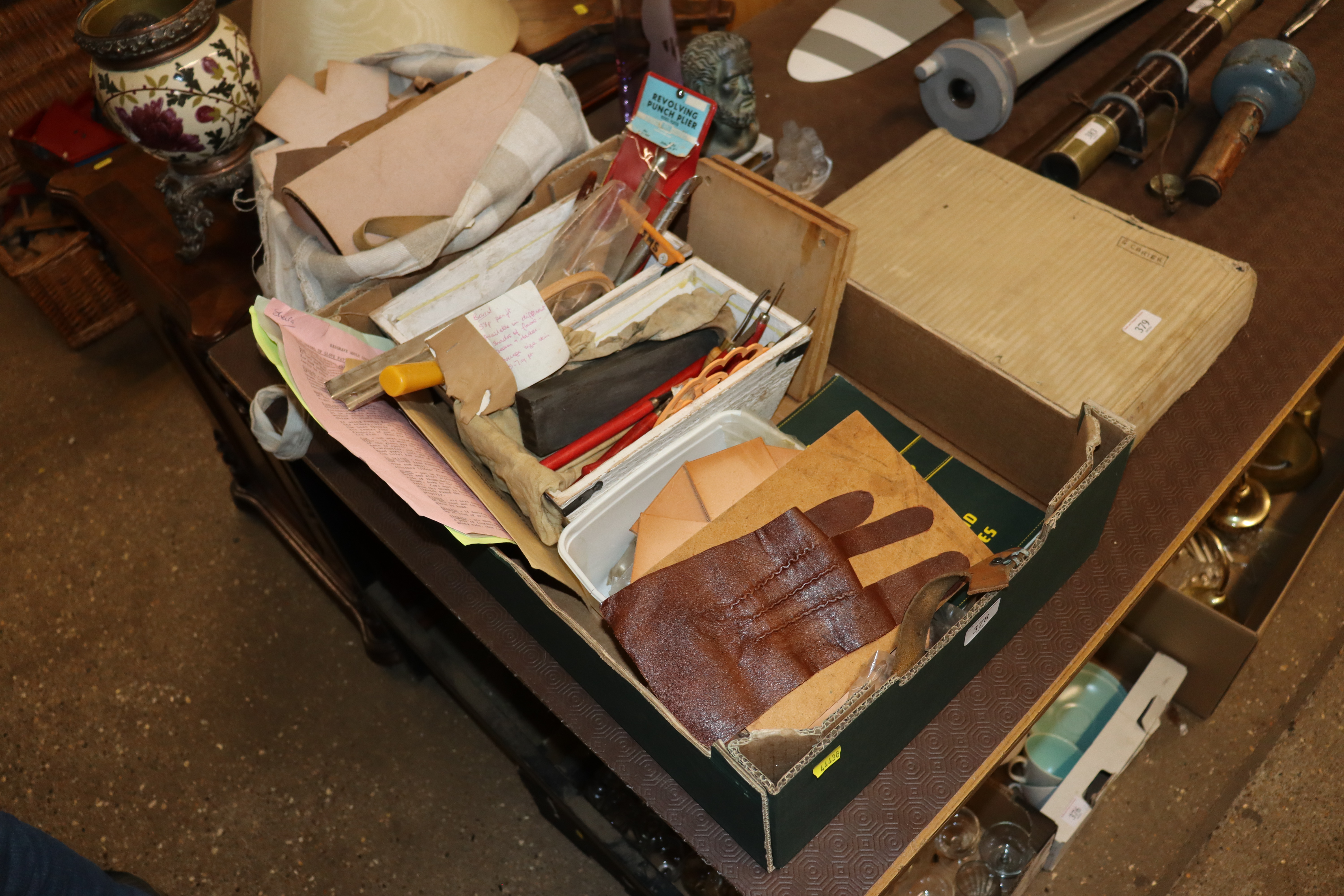 A quantity of leather tools and off-cuts of leathe