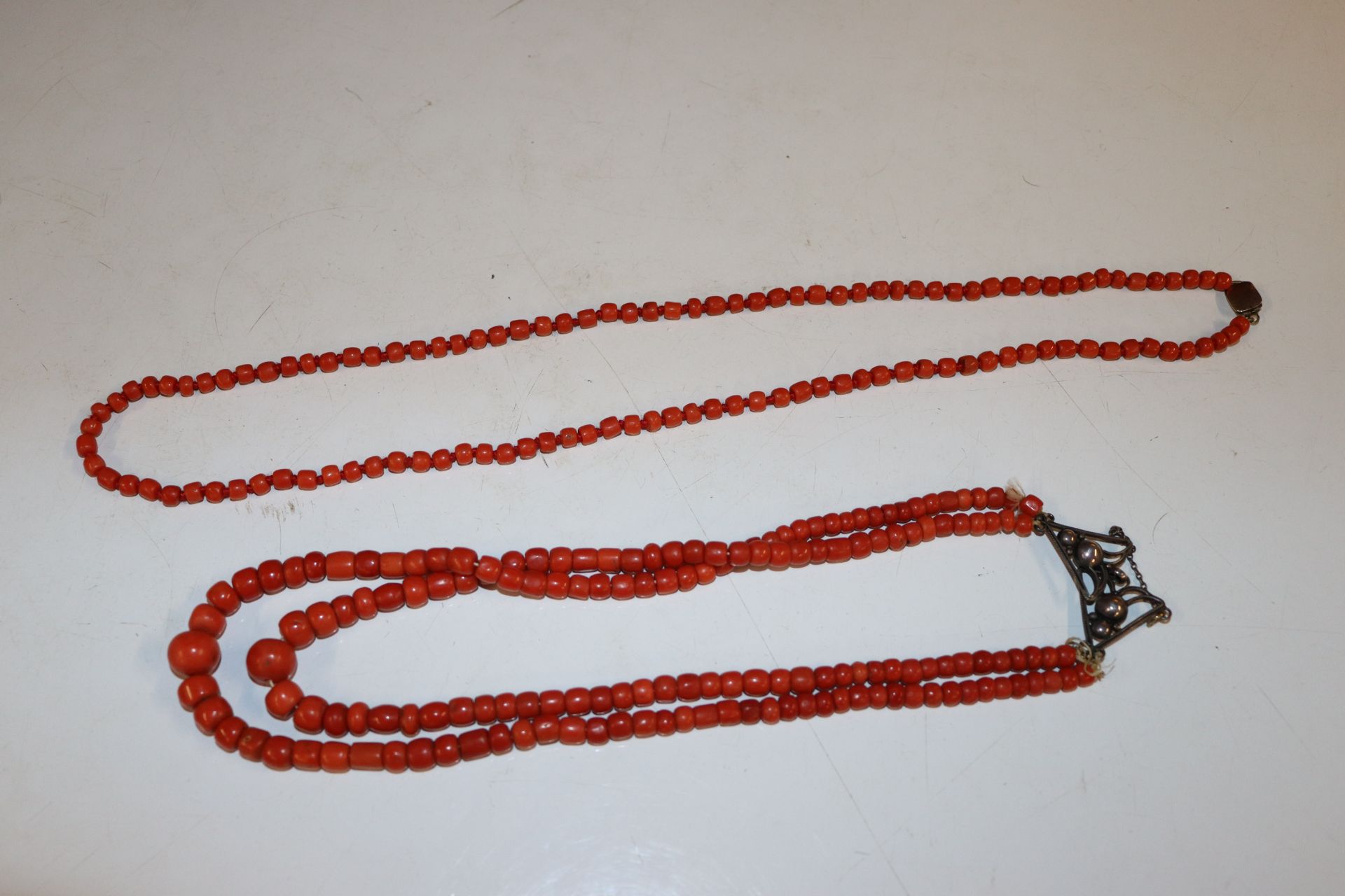 Two coral beaded necklaces