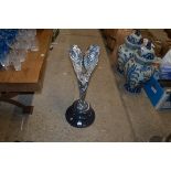 A Spirit of Ecstasy figure raised on marble plinth