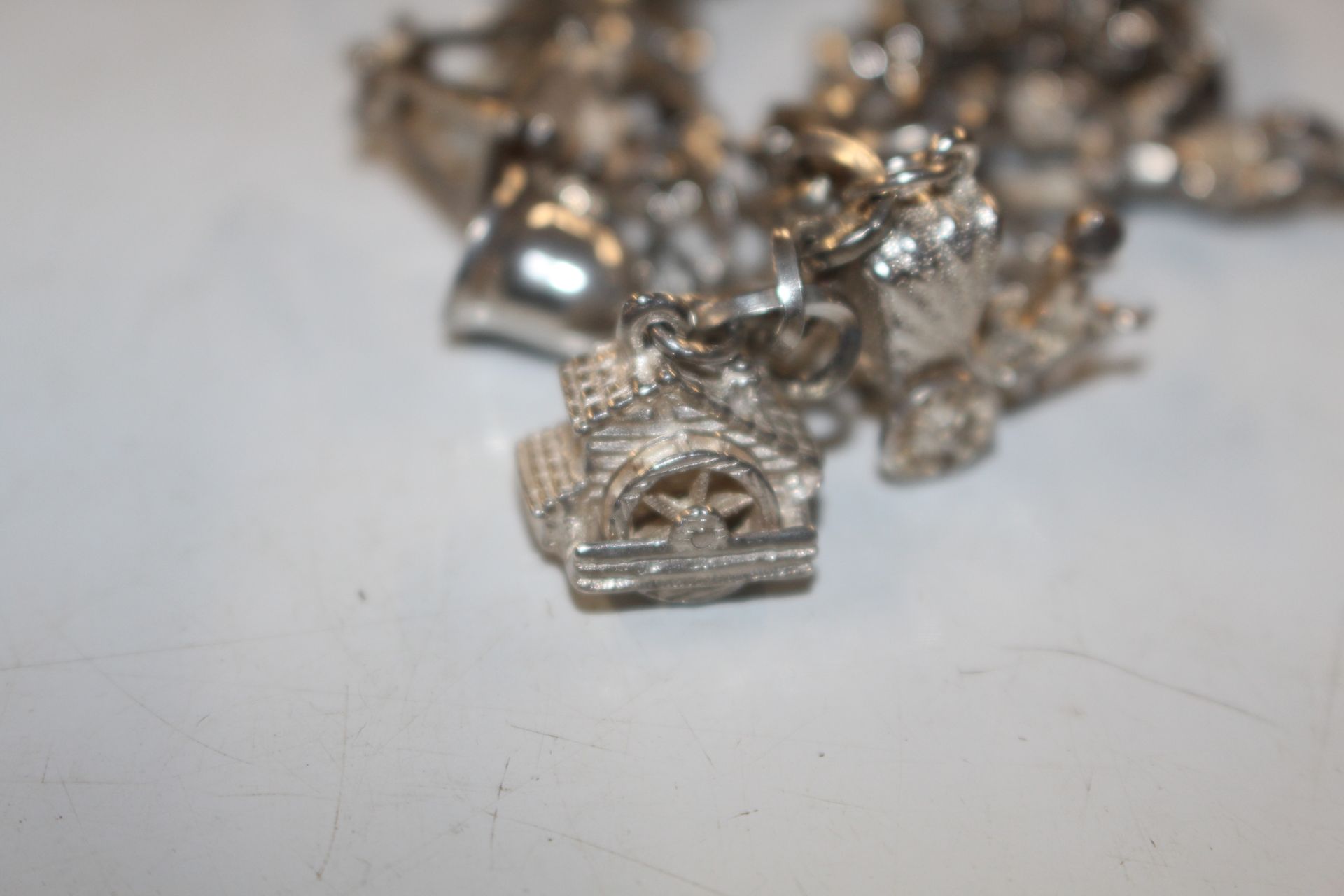 A Sterling silver charm bracelet approx. 57gms - Image 10 of 15