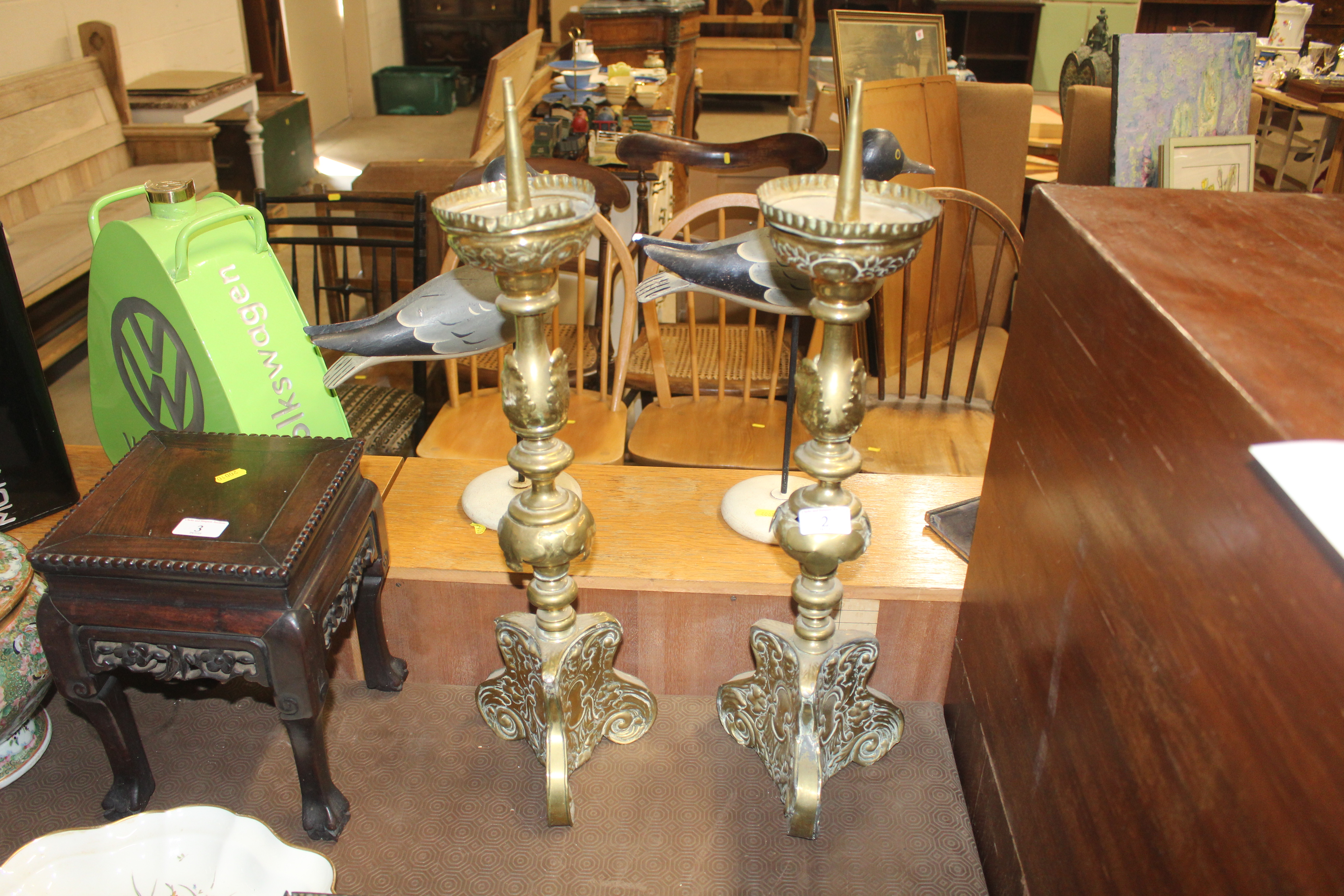 A pair of antique French brass candlesticks