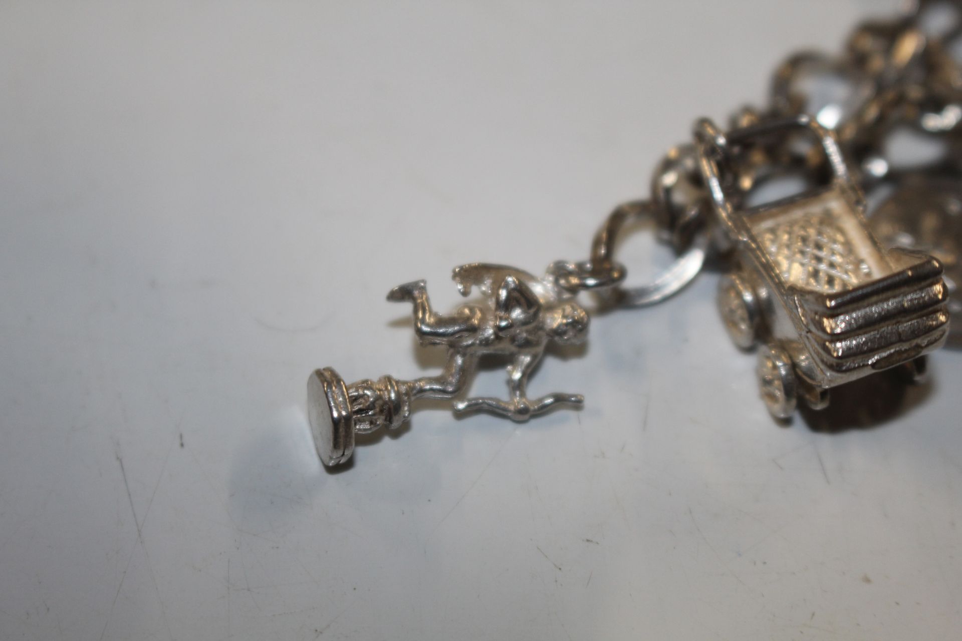 A Sterling silver charm bracelet approx. 57gms - Image 15 of 15