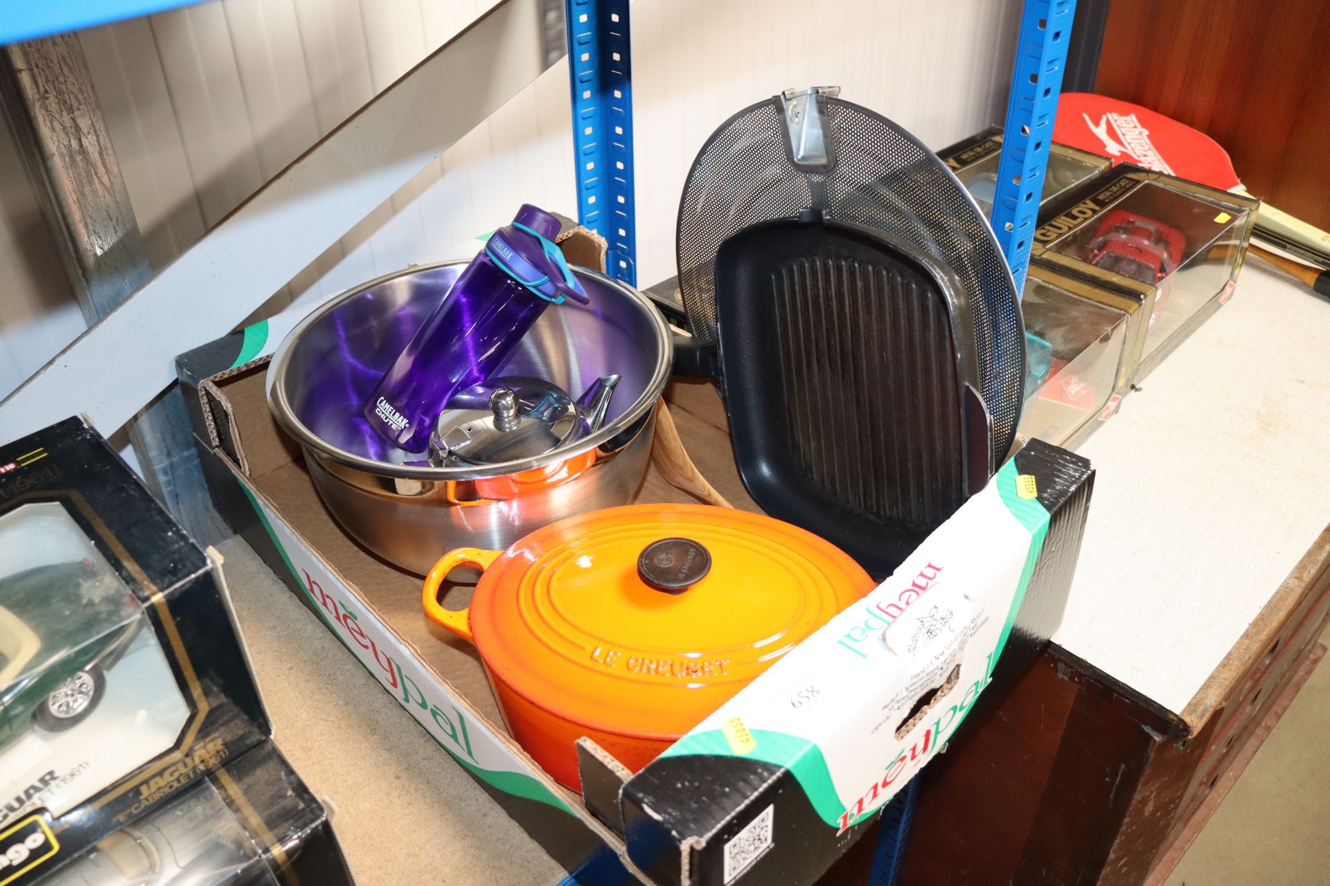 A Le Creuset casserole dish, cover and mixing bowl