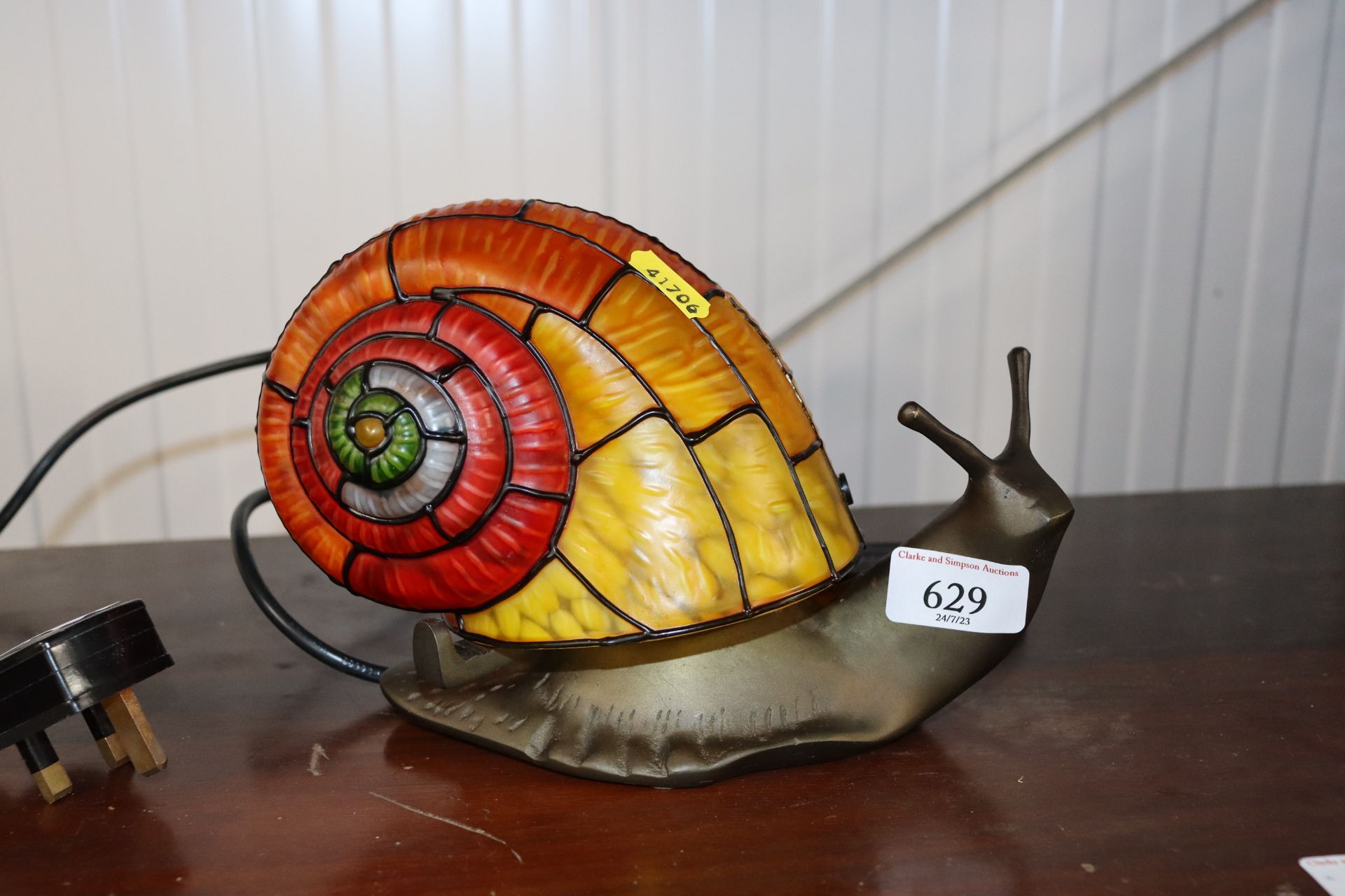 A novelty table lamp in the form of a snail