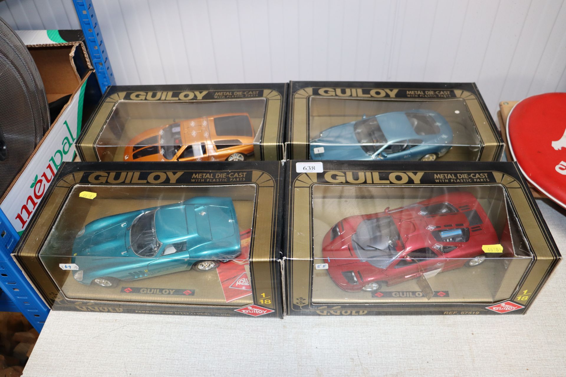 Four boxed diecast model vehicles