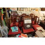 A reproduction mahogany dining table and set of si