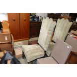 A pair of oak and striped upholstered highbacked c