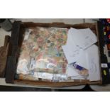 A box of various loose stamps