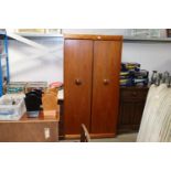 An Eon teak two door wardrobe