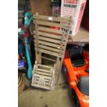 A wooden slat folding chair together with a child'