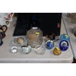 A collection of glass paperweights and two ashtray