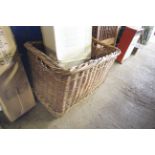 A wicker basket measuring approx. 20" x 30" x 21"