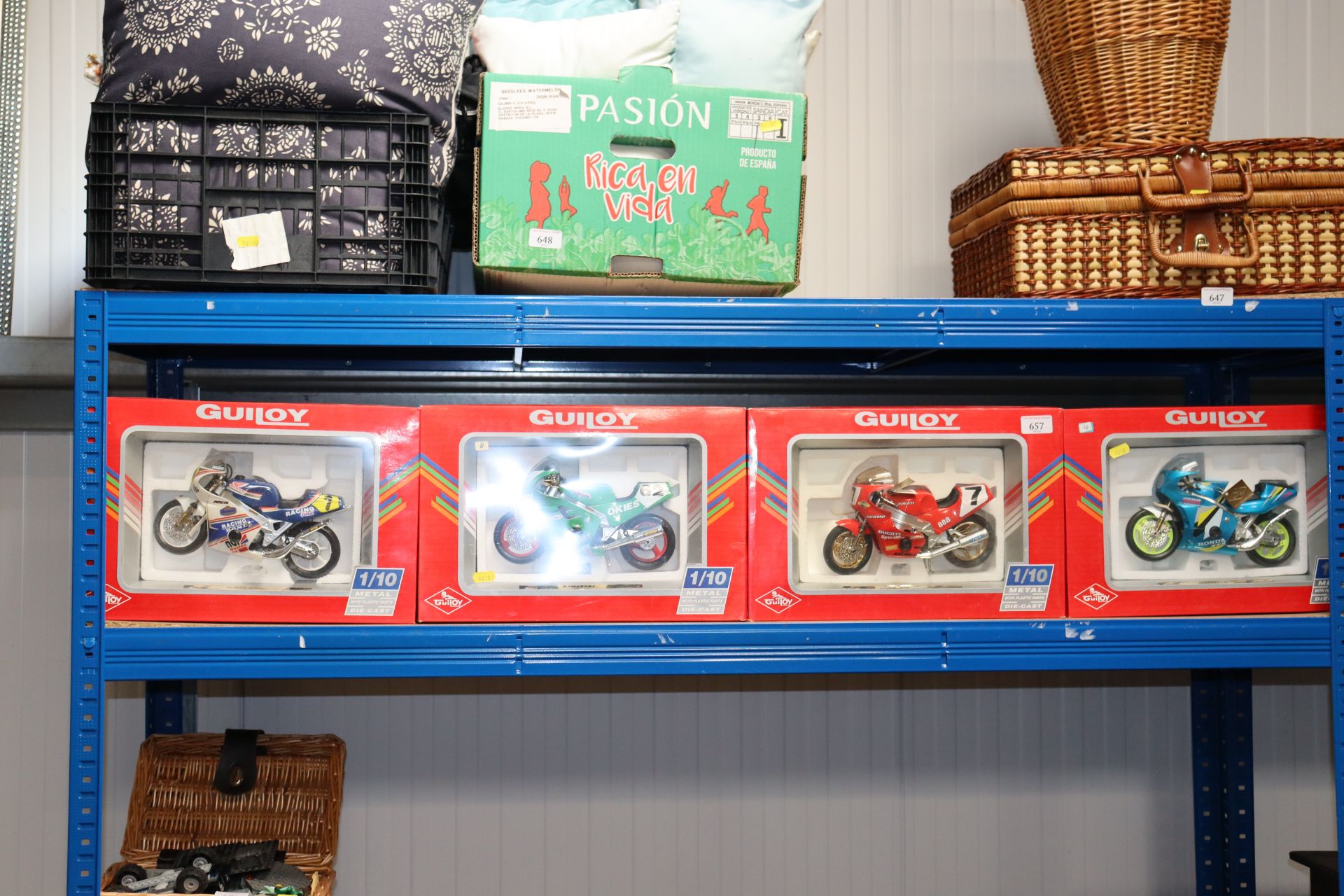 Four boxed diecast model motorbikes