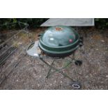 A B & Q outdoor charcoal BBQ with enamel hinged li