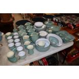 A collection of green glazed Denby dinner and teaw