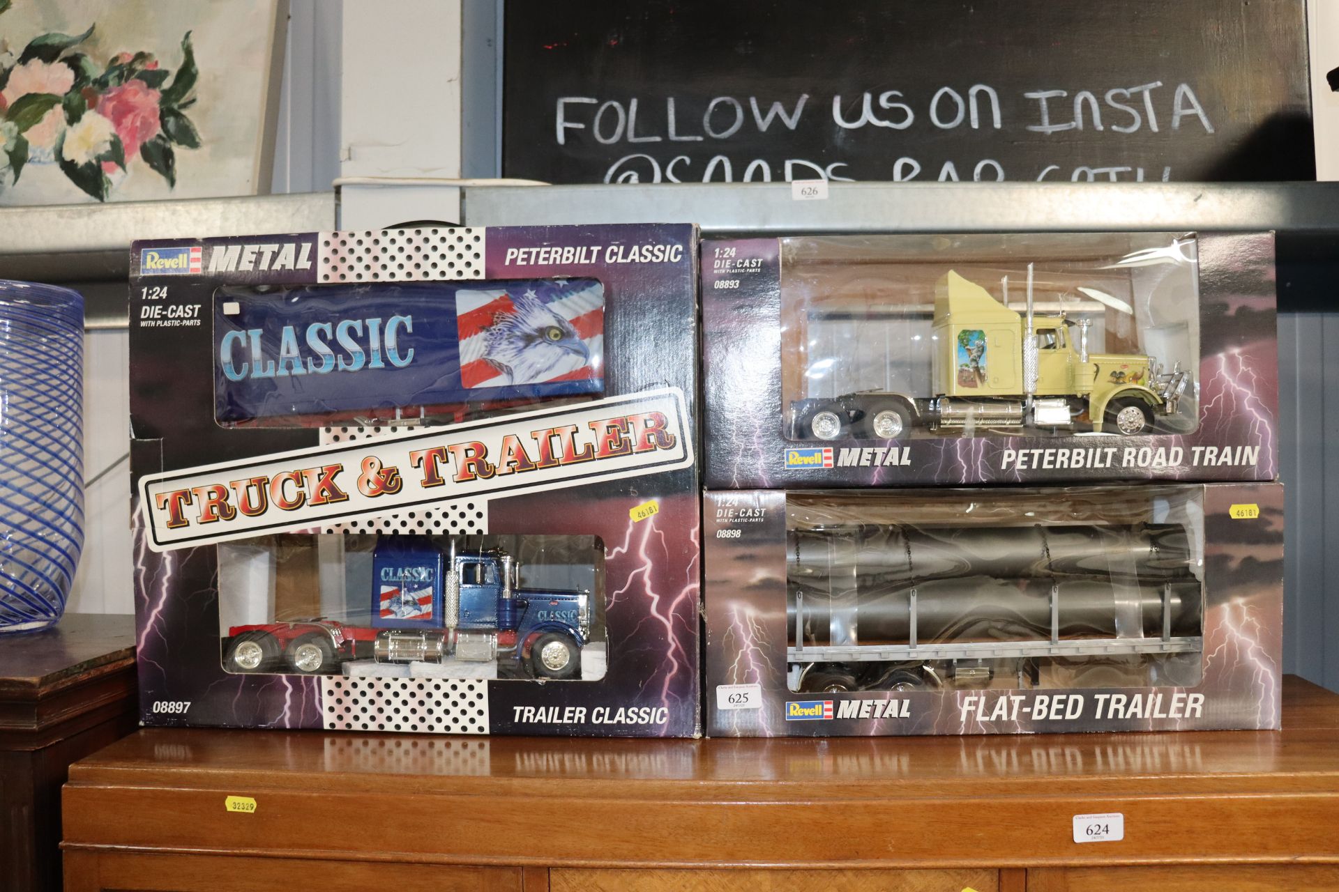 Three Revell boxed diecast trucks and trailer