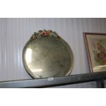 A circular Barbola style mirror