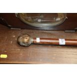 A walking stick with four sided Buddha's head handle (11)