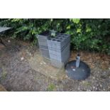 A garden parasol base, a TrapMan pest trap, a qual