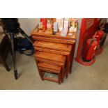 A nest of four Oriental hardwood occasional tables