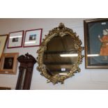 A gilt framed wall mirror