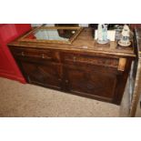 An oak side cupboard fitted two drawers AF