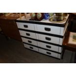 A white painted and metal bound four drawer chest